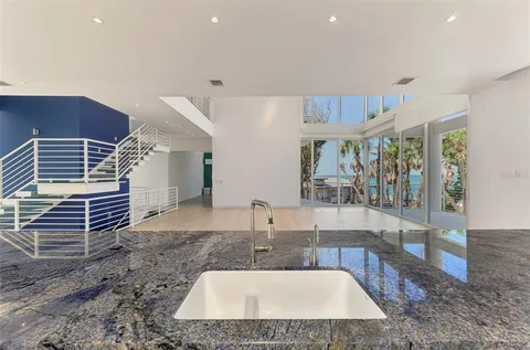 a living room with dining table and chairs