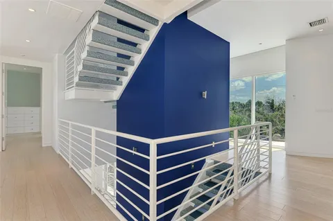 a view of deck with wooden floor and white walls