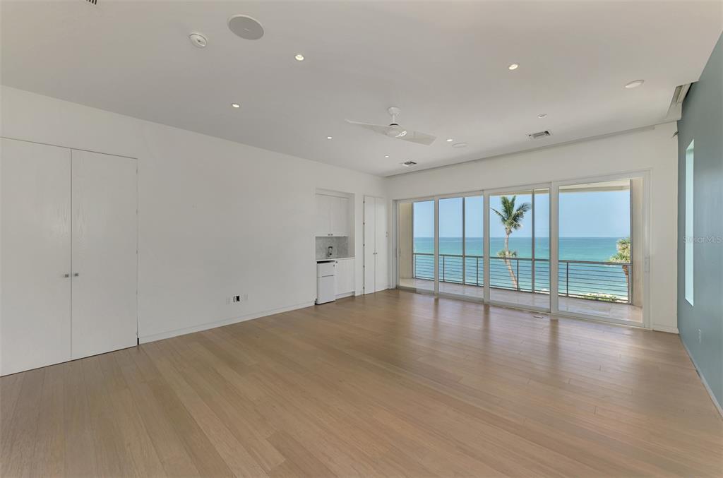 7410 Manasota Key Road Englewood, FL 34223 - Photo 24 of 45 wooden floor in an empty room with a window