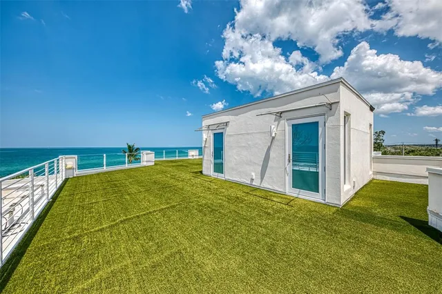 a view of a backyard of the house