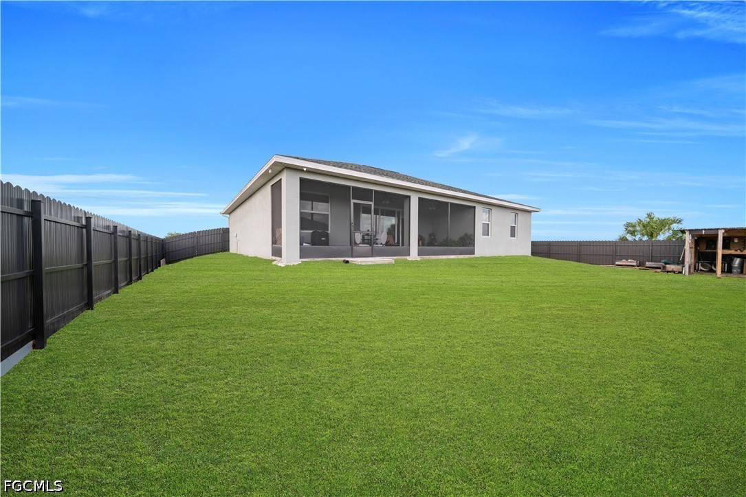 384 Neighborly Road LaBelle, FL 33935 - Photo 32 of 45 a view of a house with backyard and garden