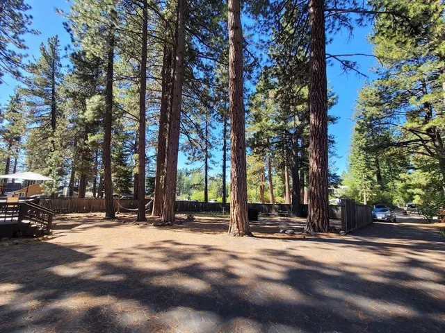 a view of a house with trees in the background