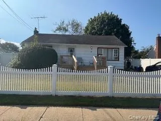 a view of a house with a fence