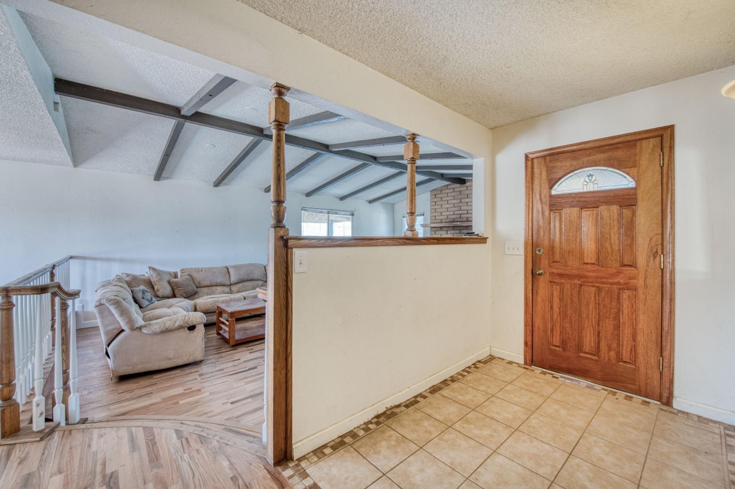 22452 Goldrush Lane Clovis, CA 93619 - Photo 2 of 36 a view of a livingroom with furniture and windows