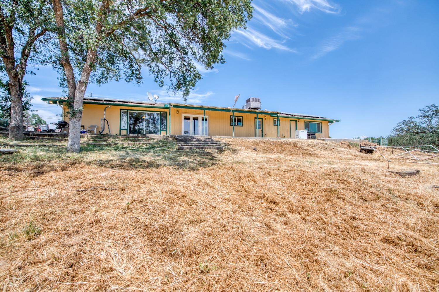 22452 Goldrush Lane Clovis, CA 93619 - Photo 25 of 36 a front view of a house with a yard