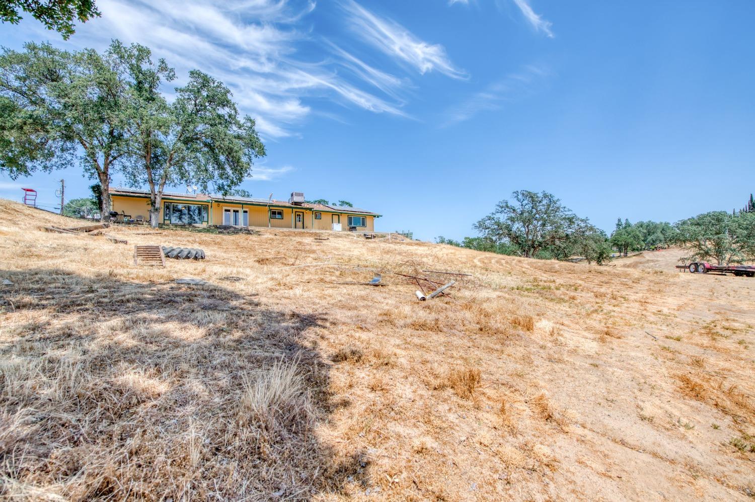 22452 Goldrush Lane Clovis, CA 93619 - Photo 26 of 36 a view of a road with a building in the background