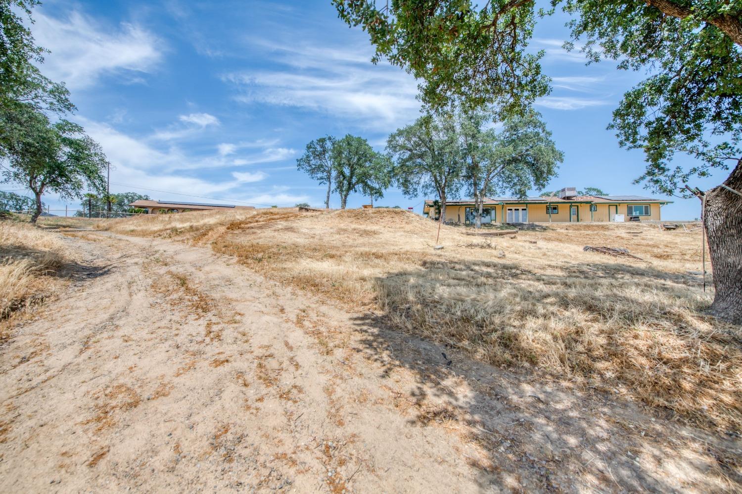 22452 Goldrush Lane Clovis, CA 93619 - Photo 31 of 36 a view of swimming pool with a yard