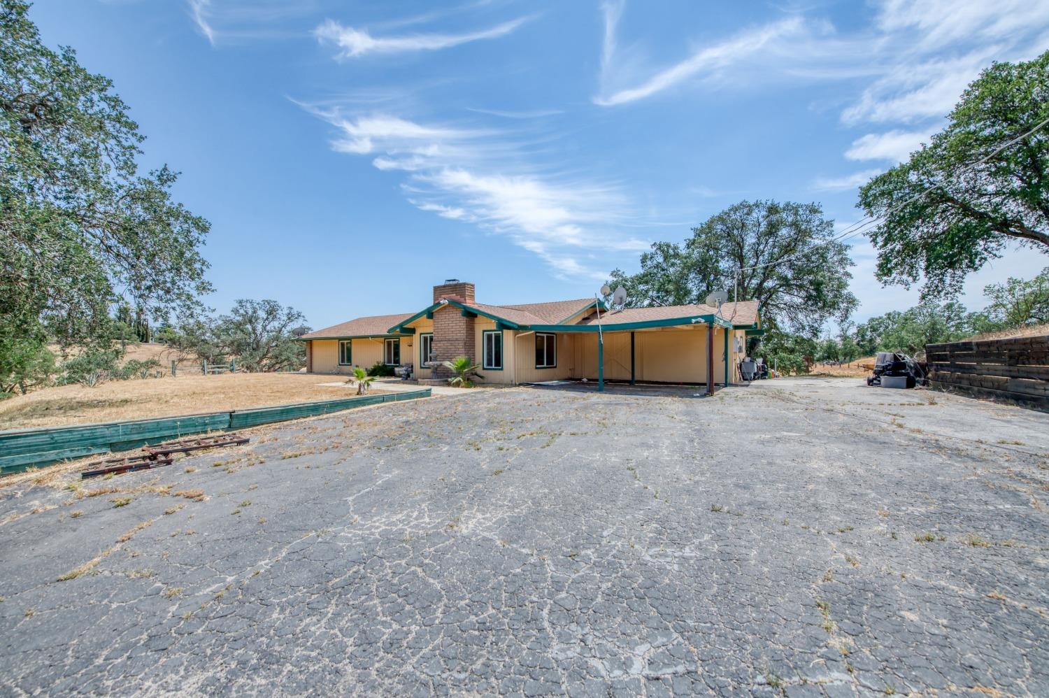 22452 Goldrush Lane Clovis, CA 93619 - Photo 35 of 36 a front view of a house with a yard