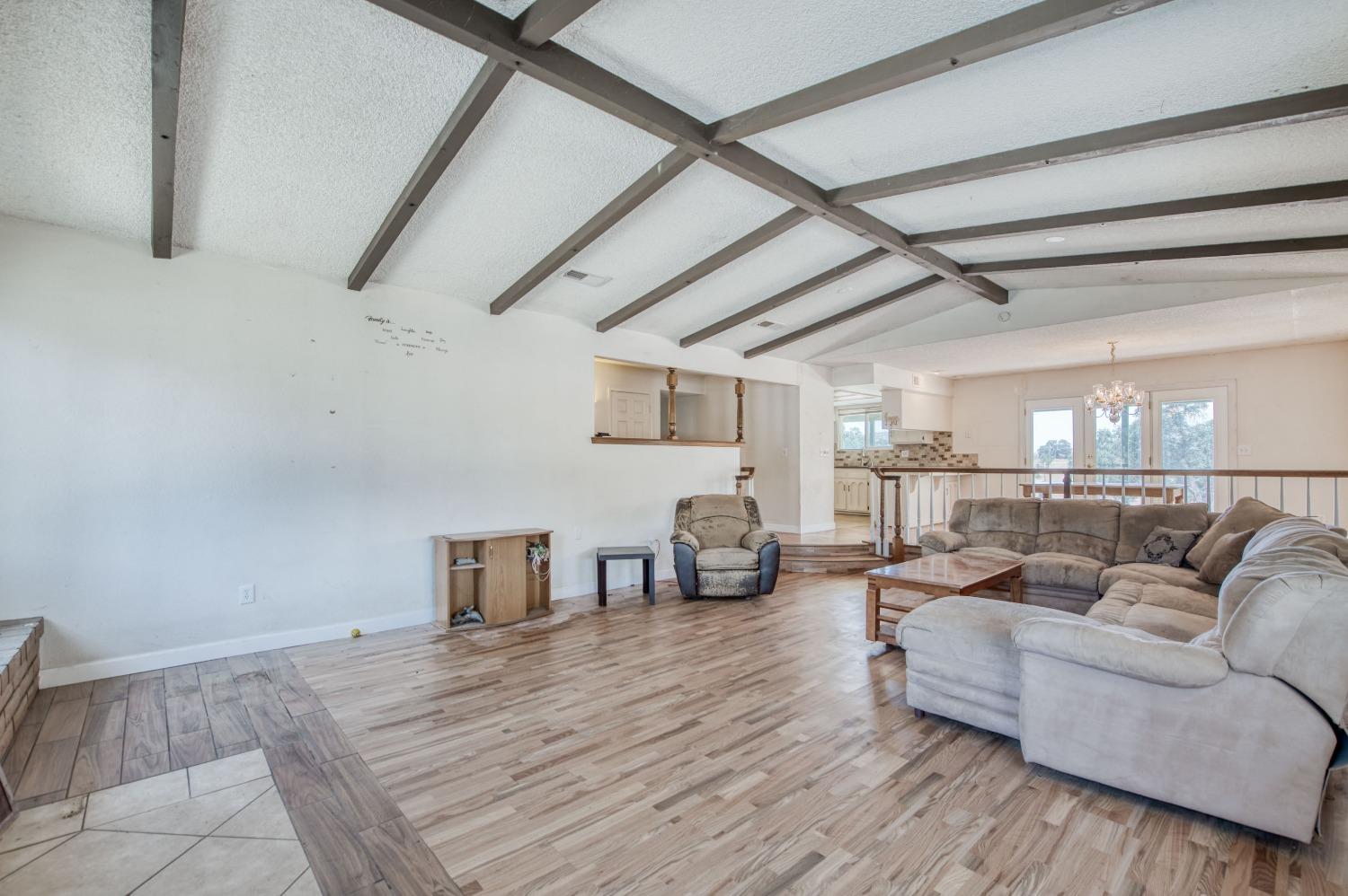 22452 Goldrush Lane Clovis, CA 93619 - Photo 7 of 36 a living room with furniture and a wooden floor