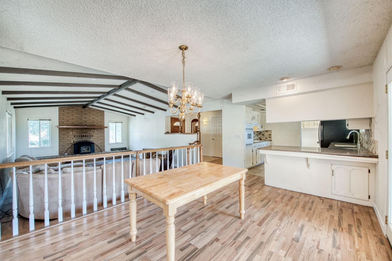 22452 Goldrush Lane Clovis, CA 93619 - Photo 8 of 36 a kitchen that has a lot of cabinets in it