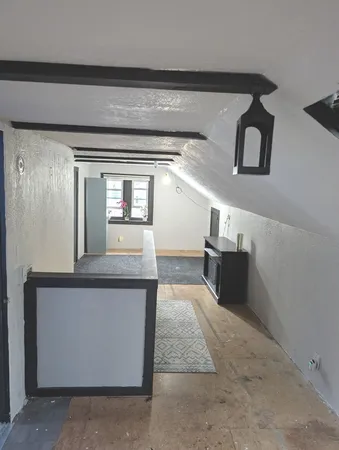 a view of a hallway with windows