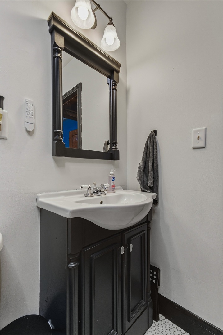 937 25th Street Moline, IL 61265 - Photo 21 of 49 a bathroom with a sink and a mirror