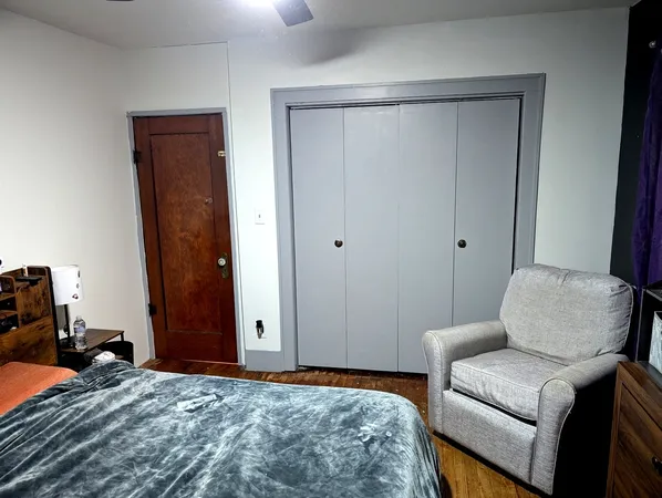 a bedroom with a bed and furniture