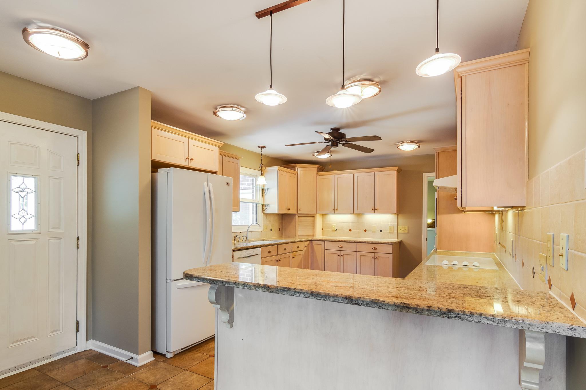 1518 Avon Road Murfreesboro, TN 37129 - Photo 1 of 22 a large kitchen with kitchen island a large counter top space appliances and cabinets