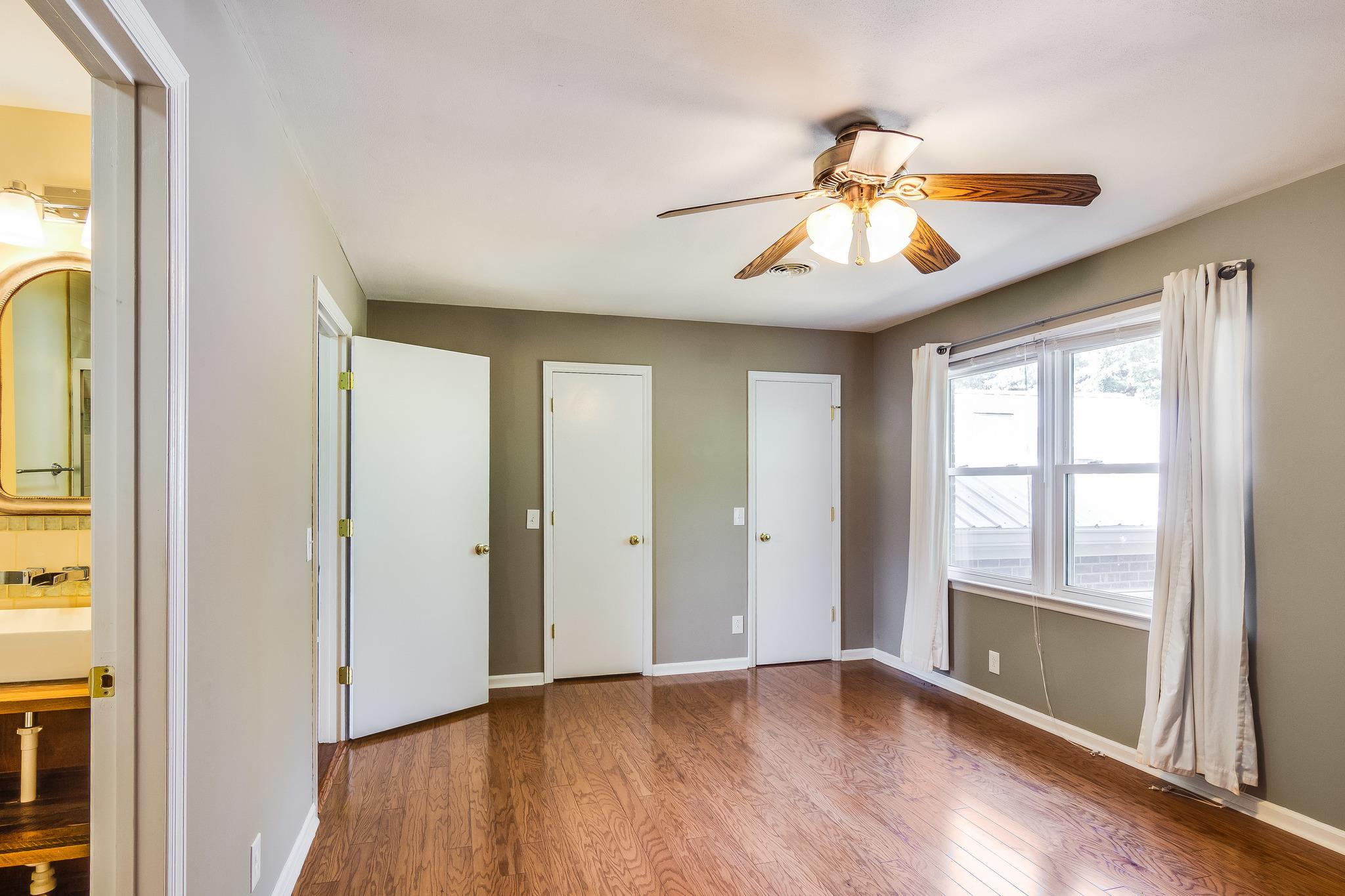1518 Avon Road Murfreesboro, TN 37129 - Photo 14 of 22 a view of an empty room with wooden floor and a window