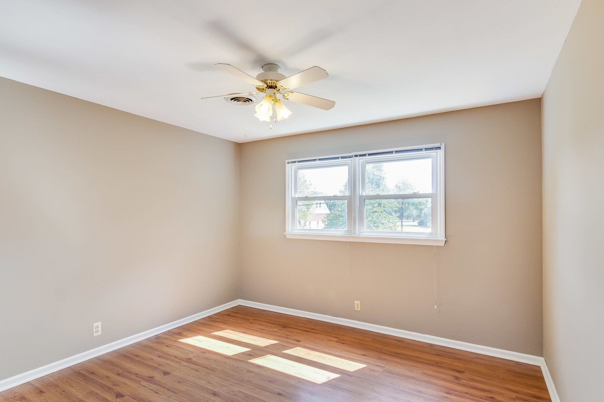 1518 Avon Road Murfreesboro, TN 37129 - Photo 16 of 22 an empty room with wooden floor chandelier fan and windows