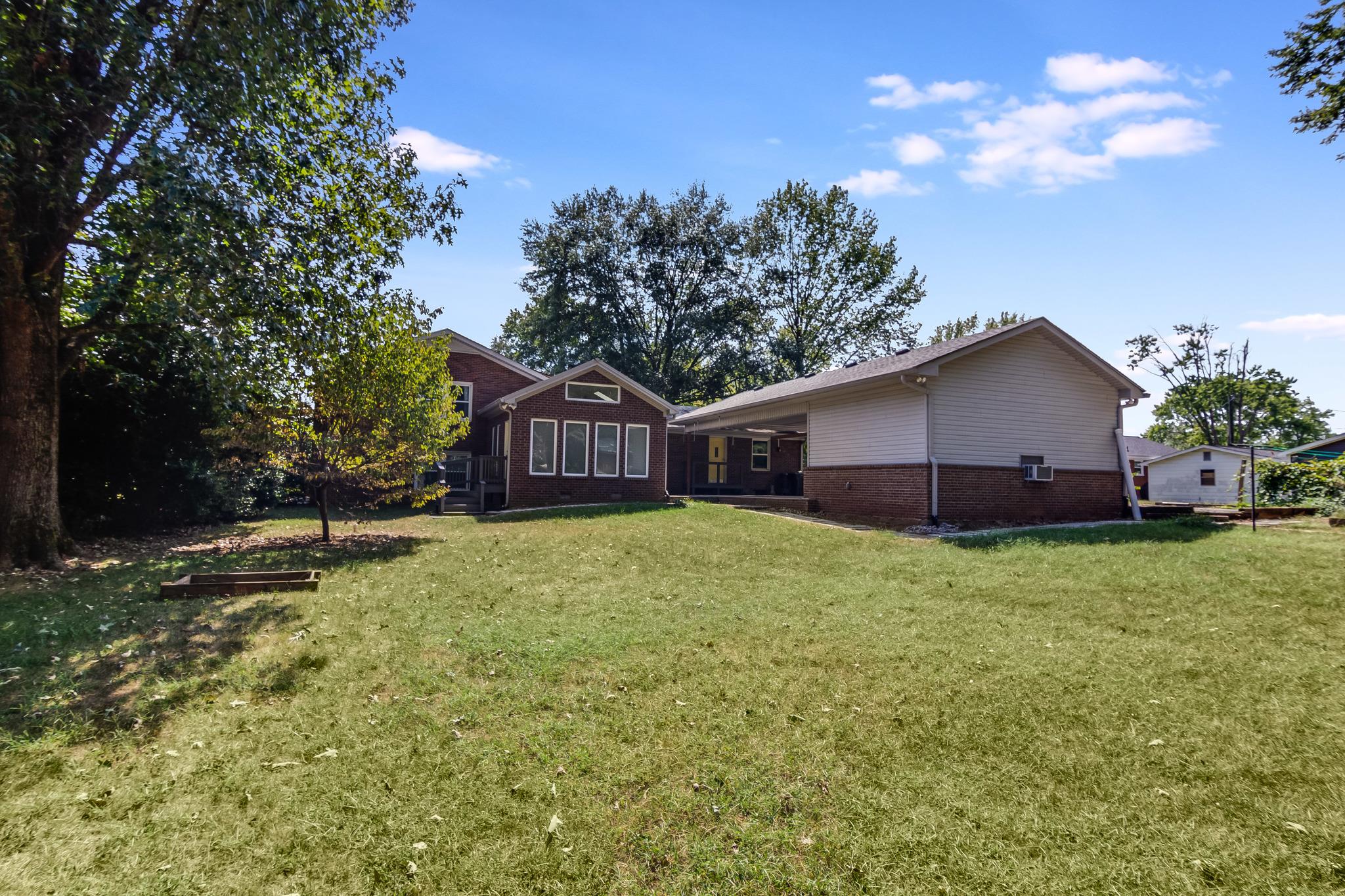 1518 Avon Road Murfreesboro, TN 37129 - Photo 20 of 22 a front view of a house with garden