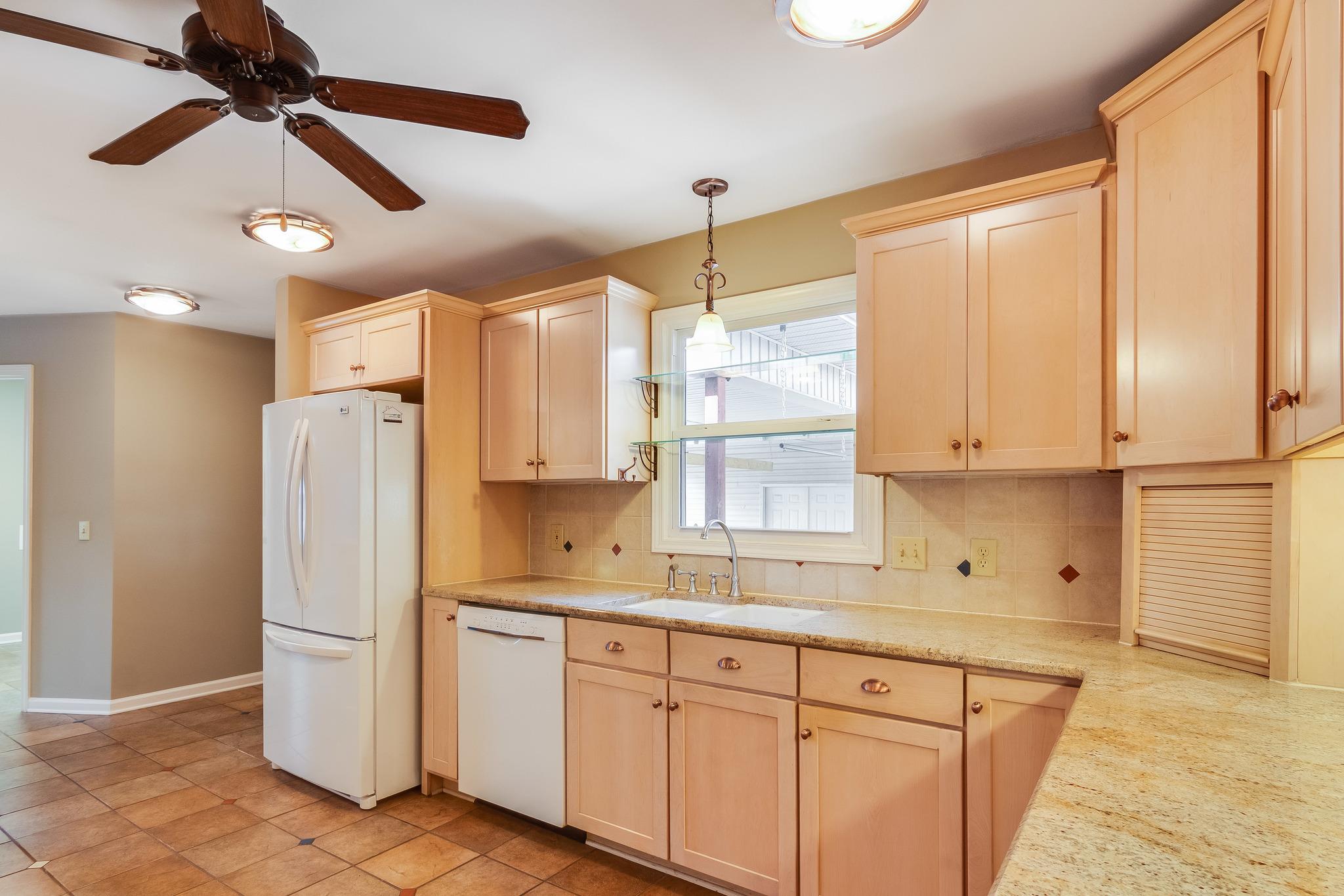 1518 Avon Road Murfreesboro, TN 37129 - Photo 2 of 22 a kitchen with a refrigerator a sink and cabinets