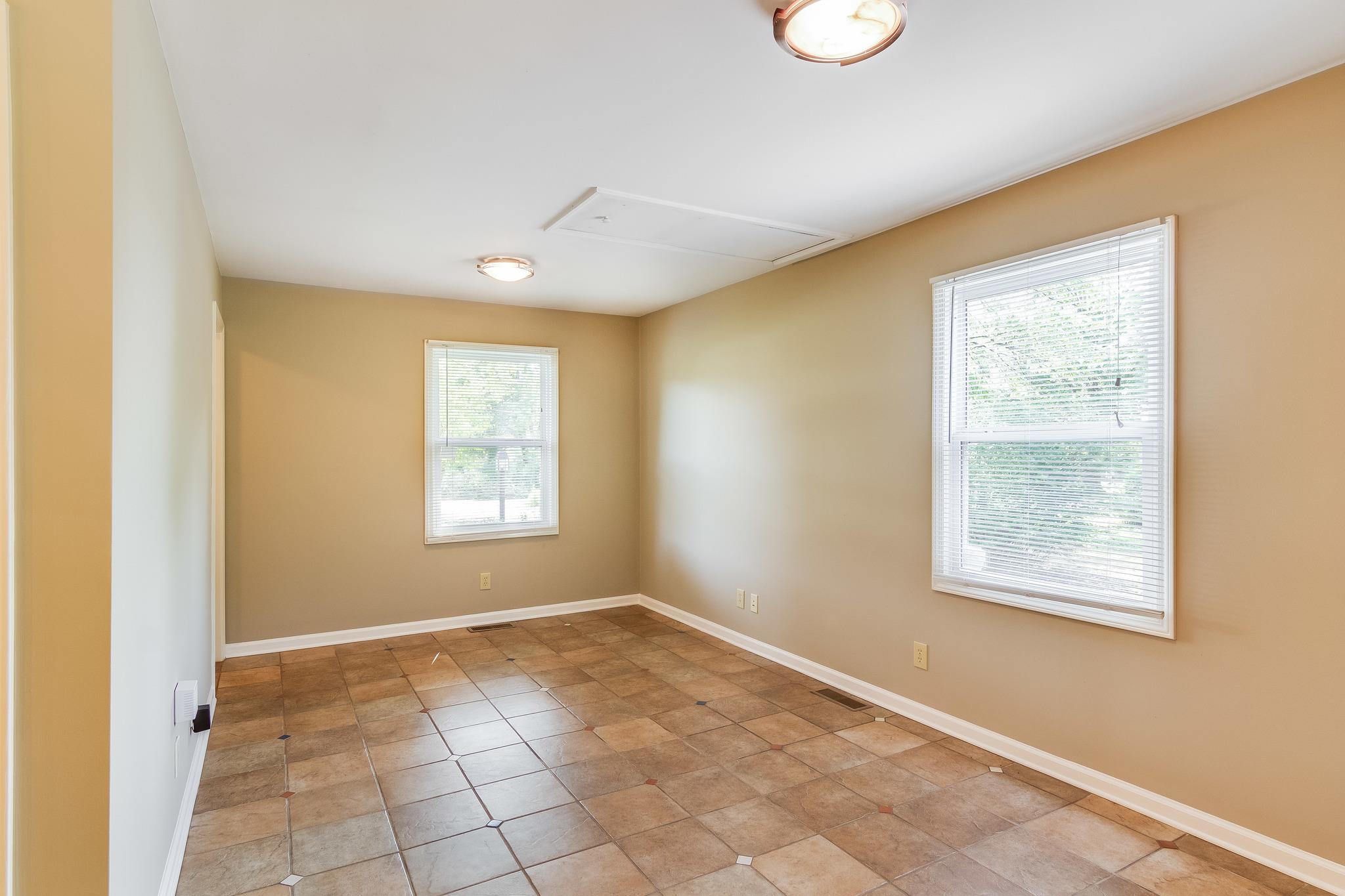 1518 Avon Road Murfreesboro, TN 37129 - Photo 6 of 22 a view of an empty room with a window and cabinet
