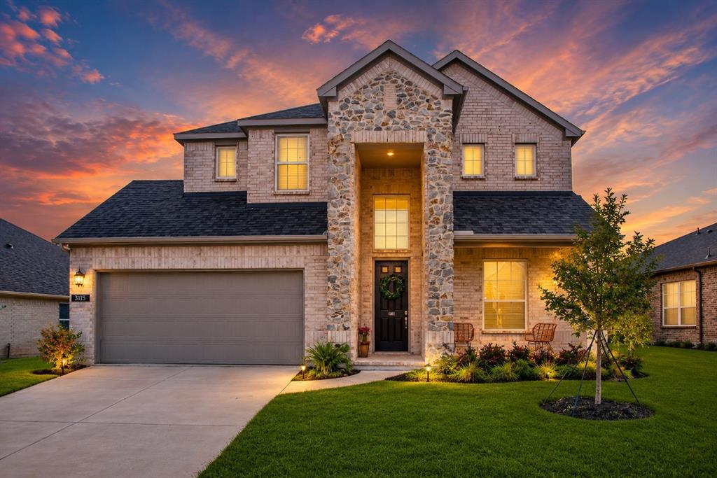 3115 Giovanni Point Princeton, TX 75407 - Photo 1 of 26 Two-story brick and stone facade with a prominent front entrance