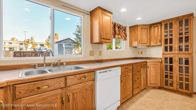 a kitchen with stainless steel appliances granite countertop a sink and a cabinets