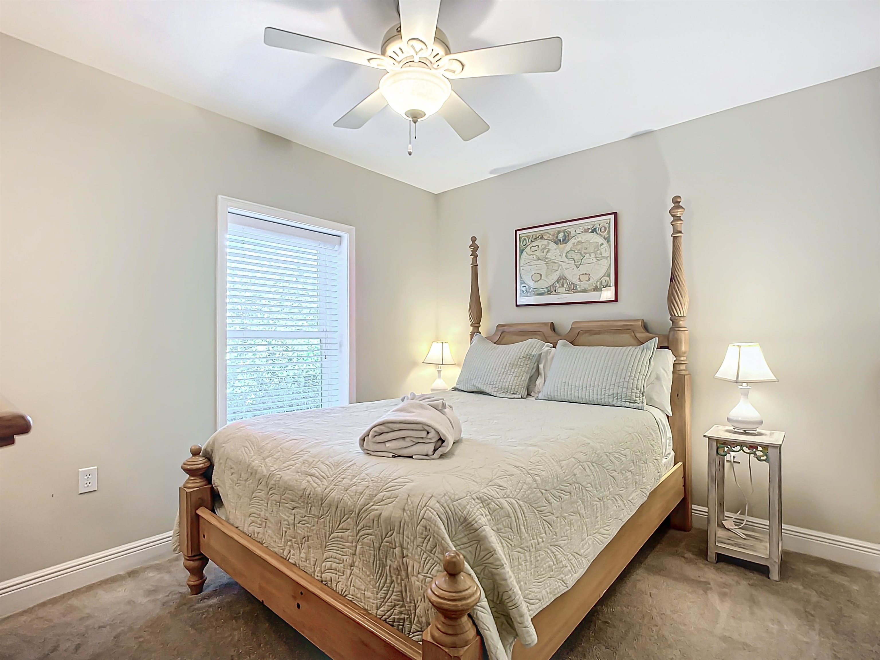 931 A1A Beach Boulevard, Unit 306 St. Augustine, FL 32080 - Photo 17 of 47 a bedroom with a bed and a chandelier