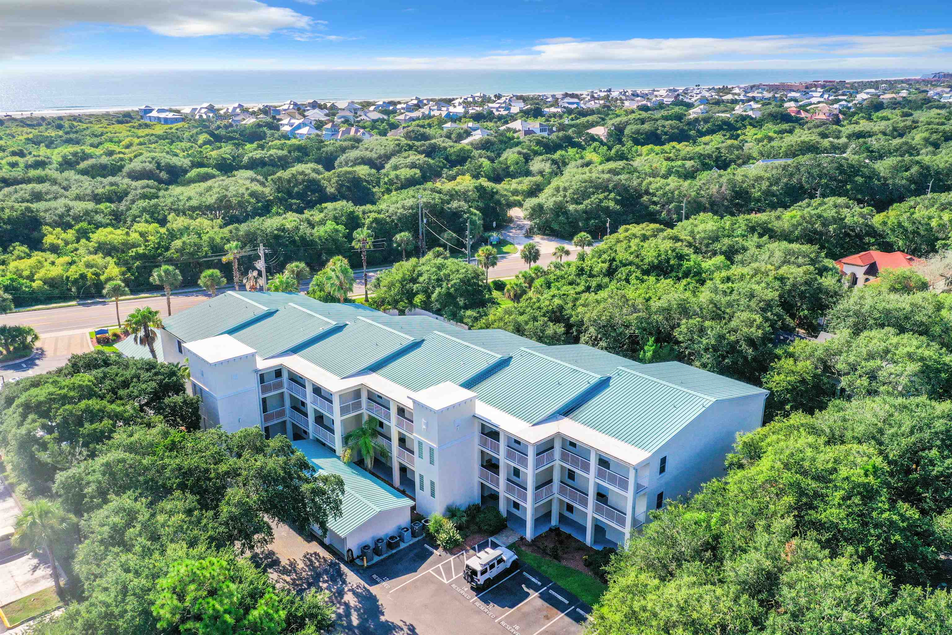 931 A1A Beach Boulevard, Unit 306 St. Augustine, FL 32080 - Photo 3 of 47 an aerial view of a house with a yard and lake view