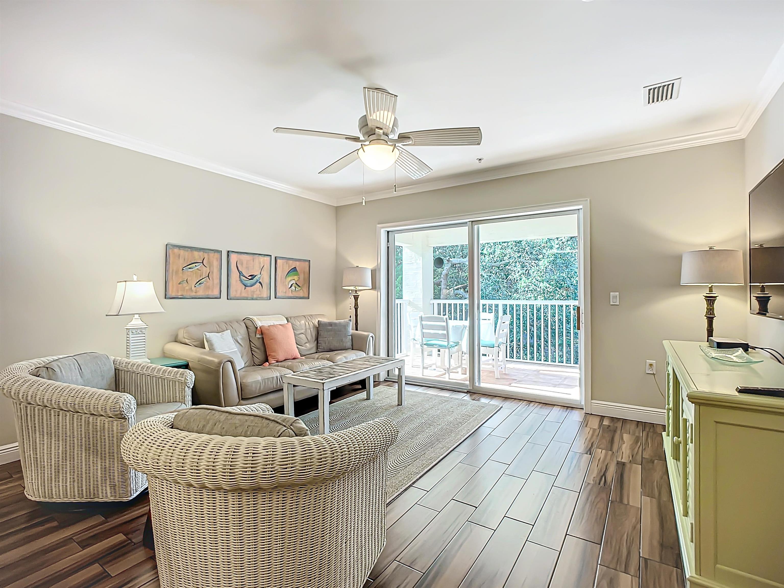 931 A1A Beach Boulevard, Unit 306 St. Augustine, FL 32080 - Photo 31 of 47 a living room with furniture and a large window