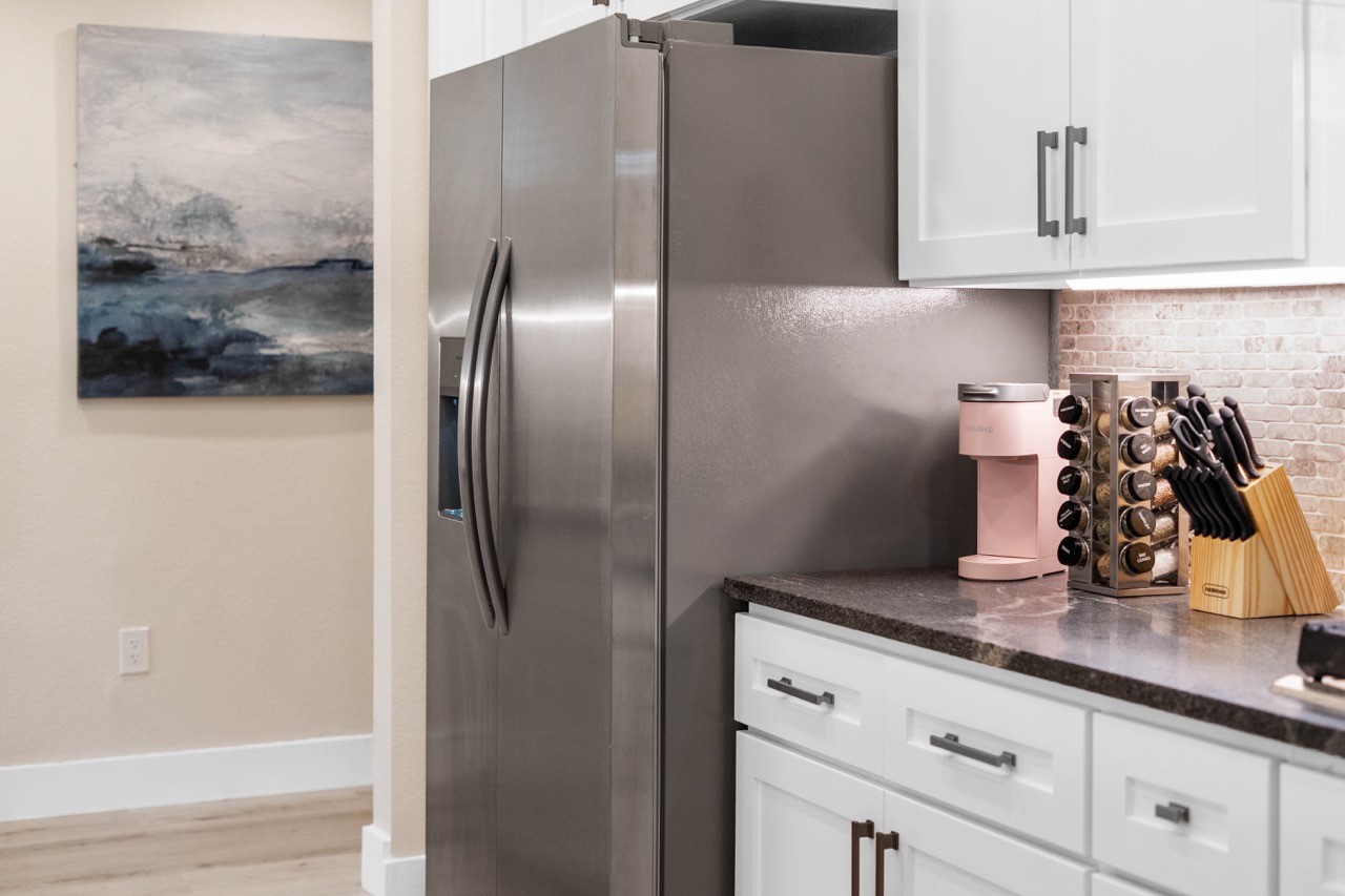 3138 Sunbeam Street Houston, TX 77051 - Photo 25 of 50 Sleek stainless appliances and polished finishes create a kitchen that feels equal parts functional, modern, and luxurious.