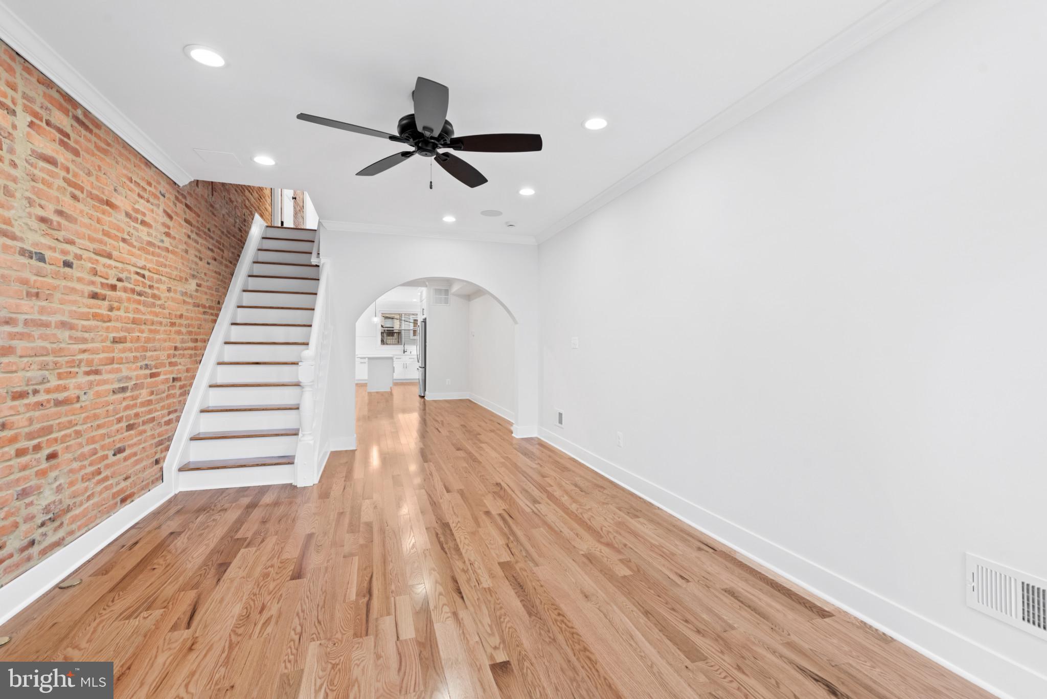 1434 Marshall Street Baltimore, MD 21230 - Photo 4 of 40 a view of a ceiling fan with wooden floor