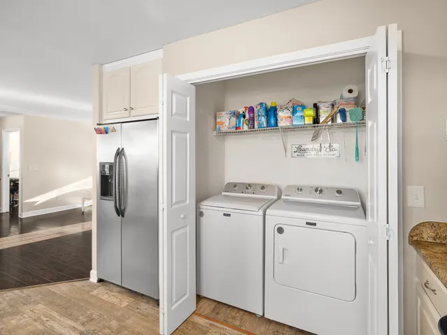 a view of storage and utility room with washer and dryer
