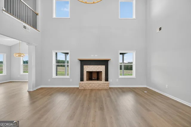 a view of an entryway with wooden floor