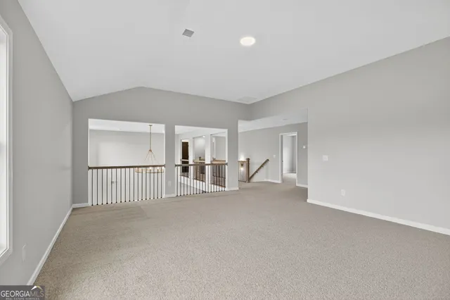 a bathroom with a granite countertop sink toilet mirror and shower
