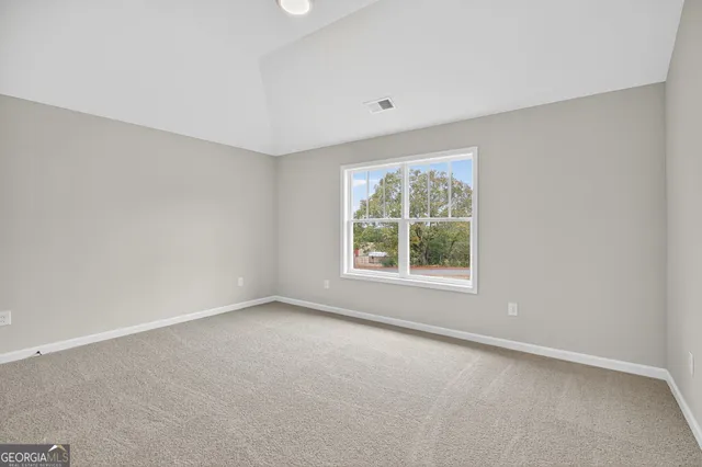 a view of lake with green space