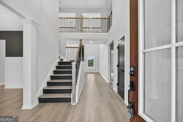a view of a room with wooden floor