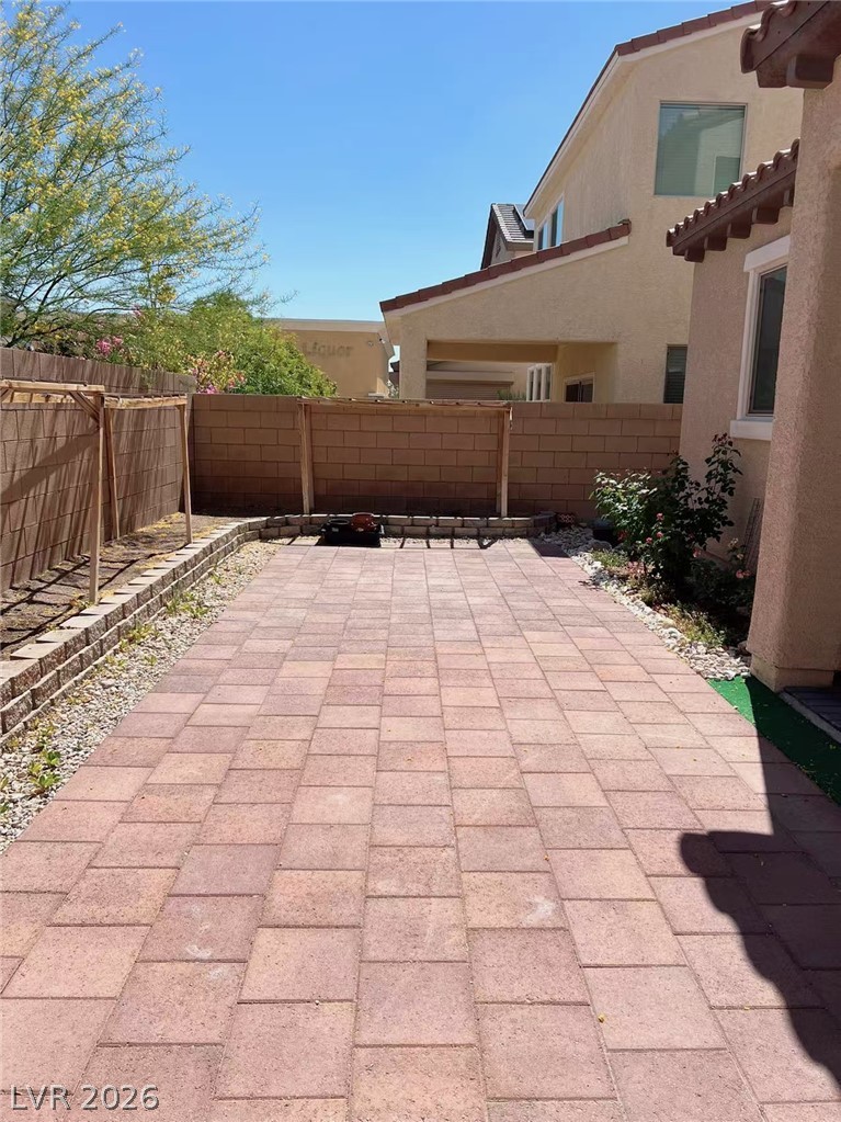 146 Tree Shot Court Las Vegas, NV 89113 - Photo 16 of 18 A well-maintained paver patio offers an ideal setting for outdoor entertaining and relaxation.