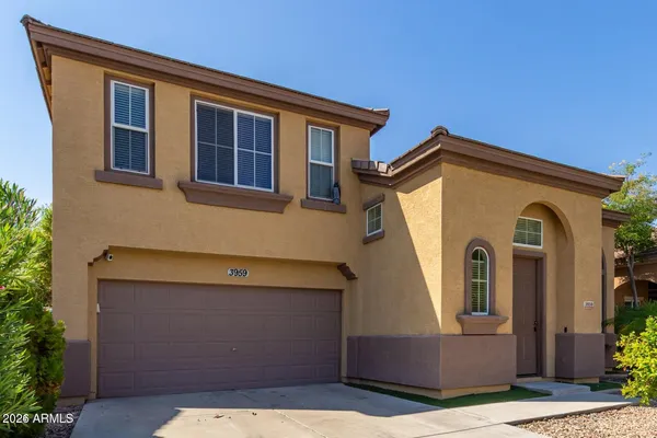 a front view of a house with garage
