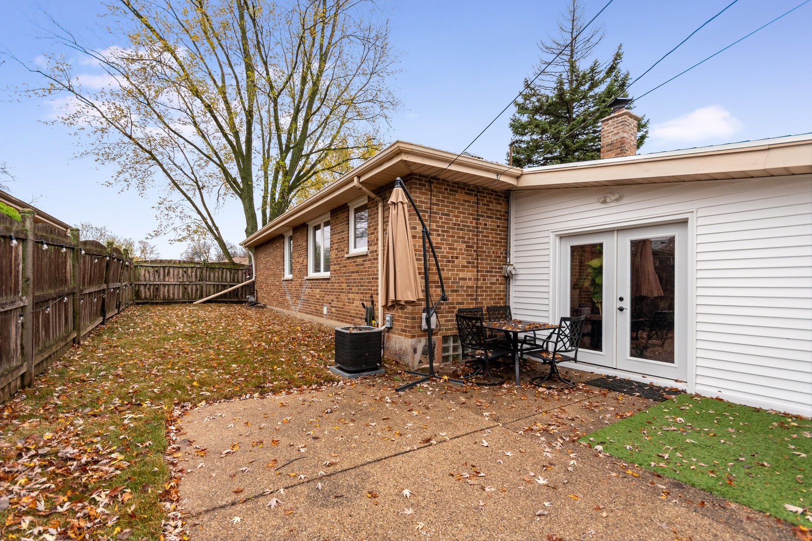 138 Janice Lane Addison, IL 60101 - Photo 16 of 18 a front view of house with yard outdoor seating and barbeque oven