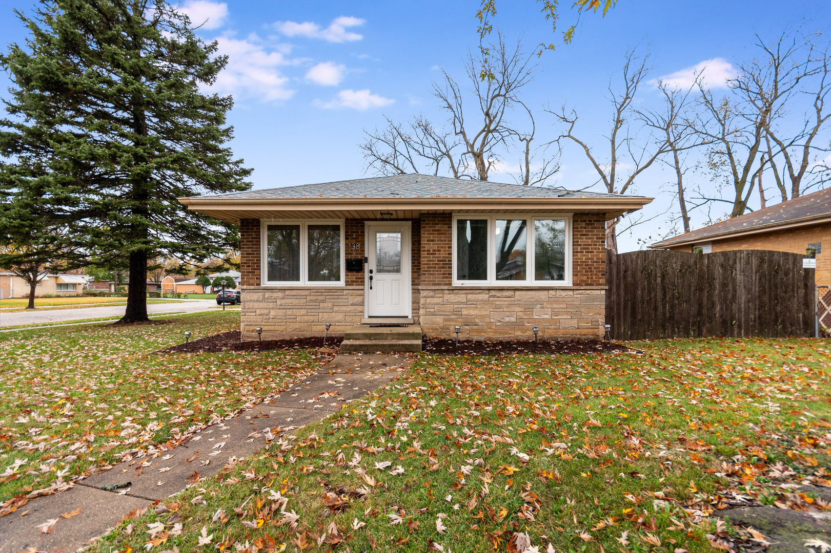 138 Janice Lane Addison, IL 60101 - Photo 2 of 18 front view of a house with a large tree