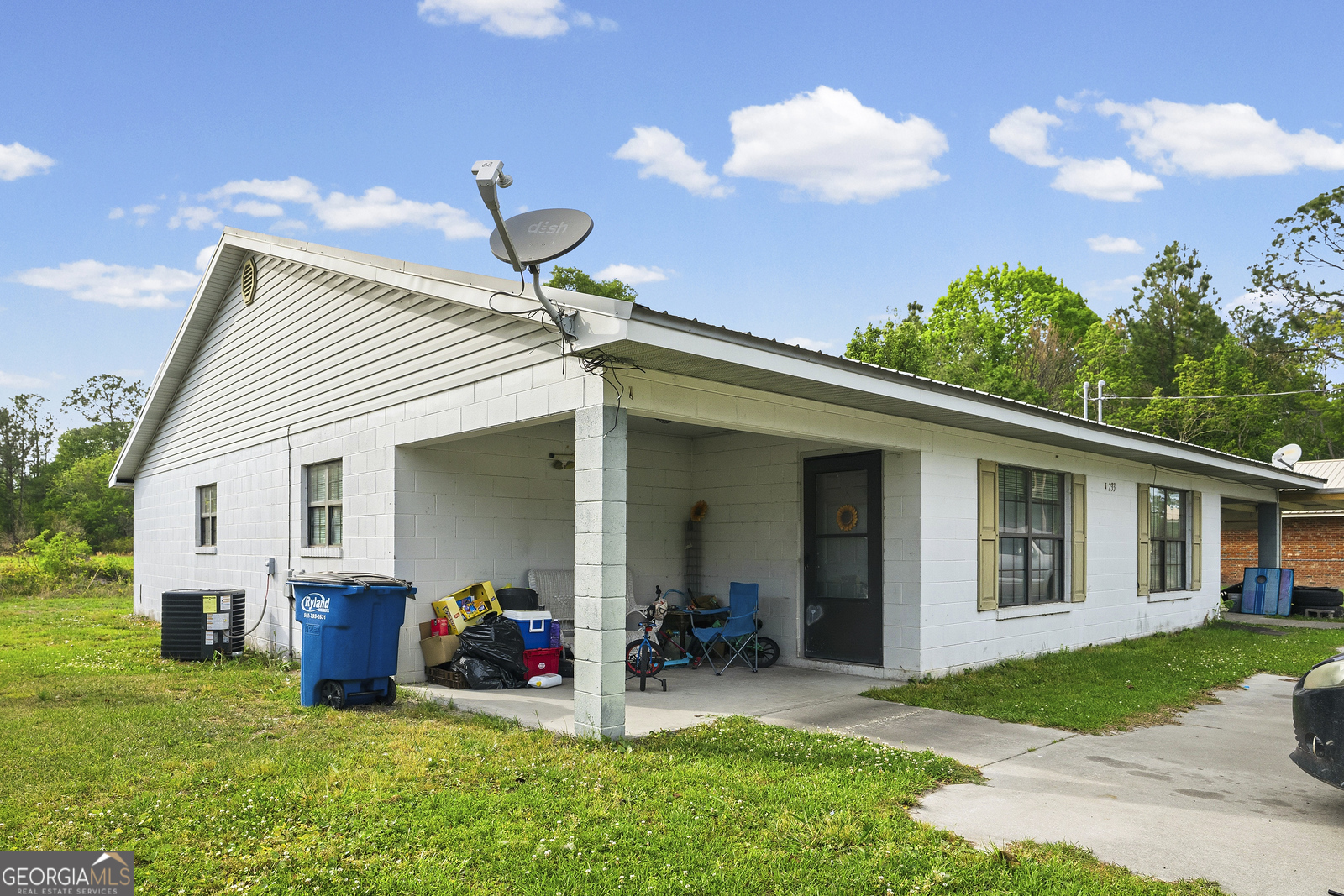 304 Cannon Street Nahunta, GA 31553 - Photo 16 of 51 a view of a house with yard and chairs