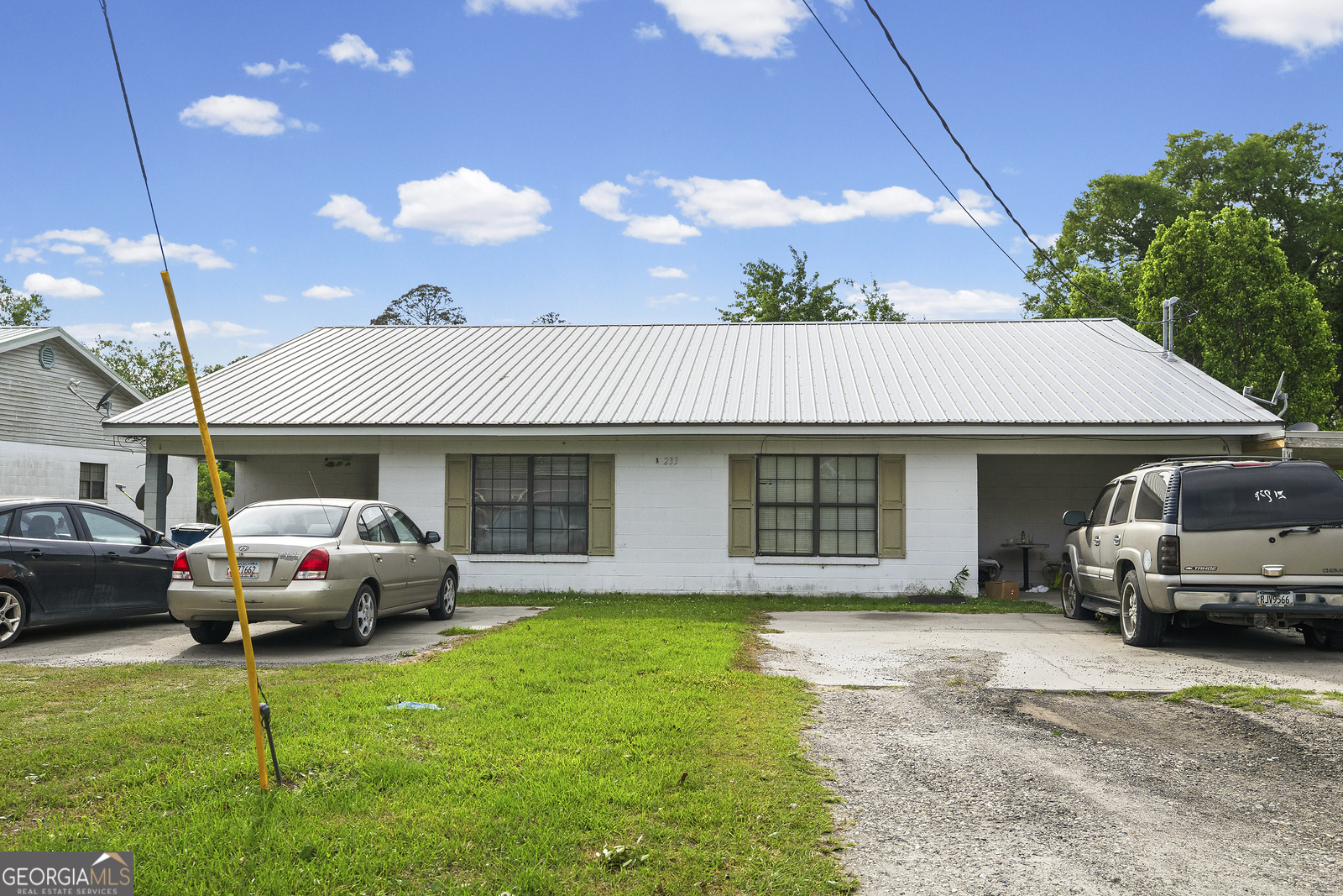 304 Cannon Street Nahunta, GA 31553 - Photo 17 of 51 a front view of a house with a garden