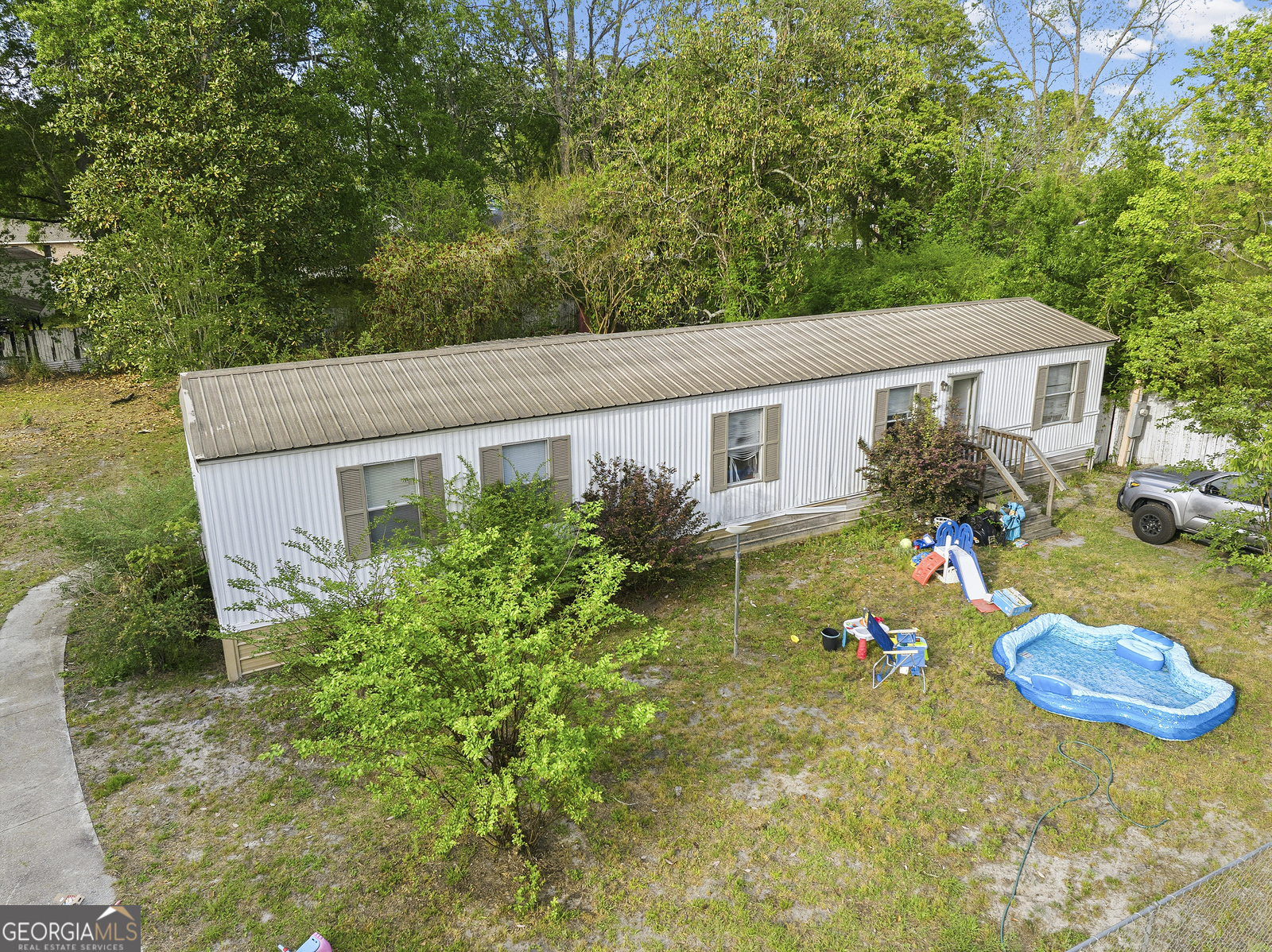 304 Cannon Street Nahunta, GA 31553 - Photo 25 of 51 a backyard of a house with seating space