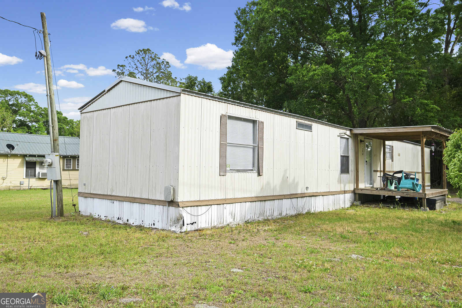 304 Cannon Street Nahunta, GA 31553 - Photo 3 of 51 a backyard of a house with table and chairs