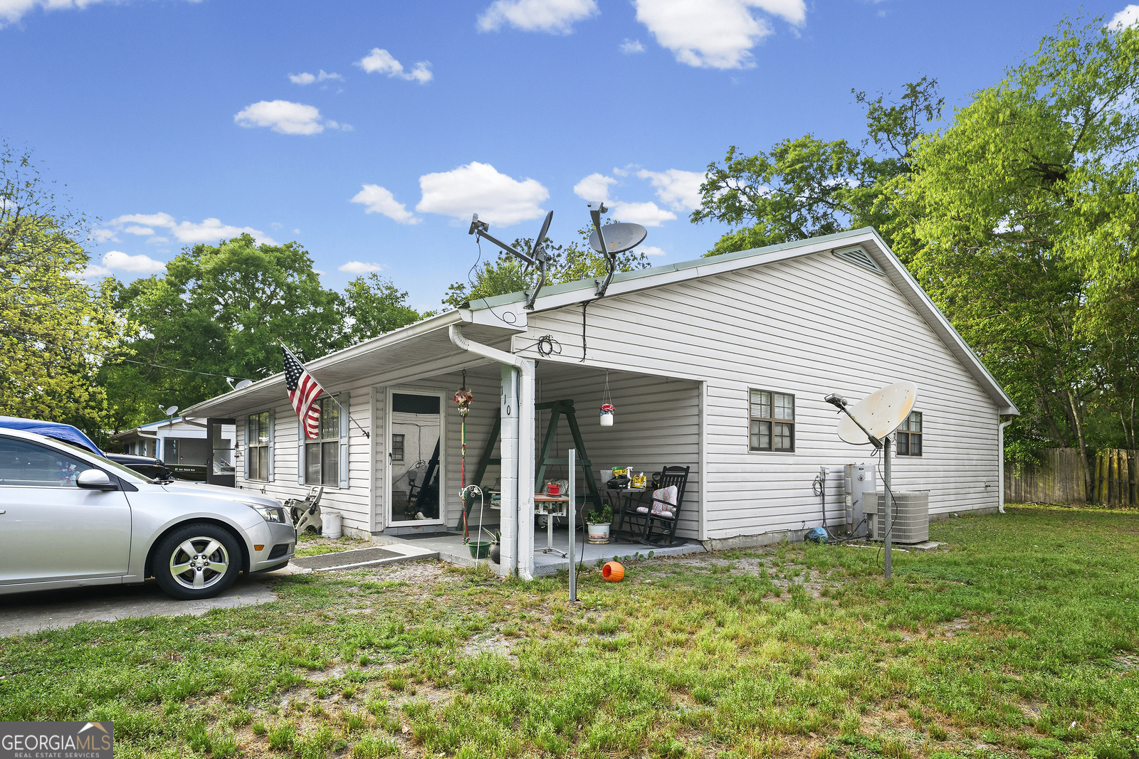 304 Cannon Street Nahunta, GA 31553 - Photo 39 of 51 a view of a house with a yard and flower plants