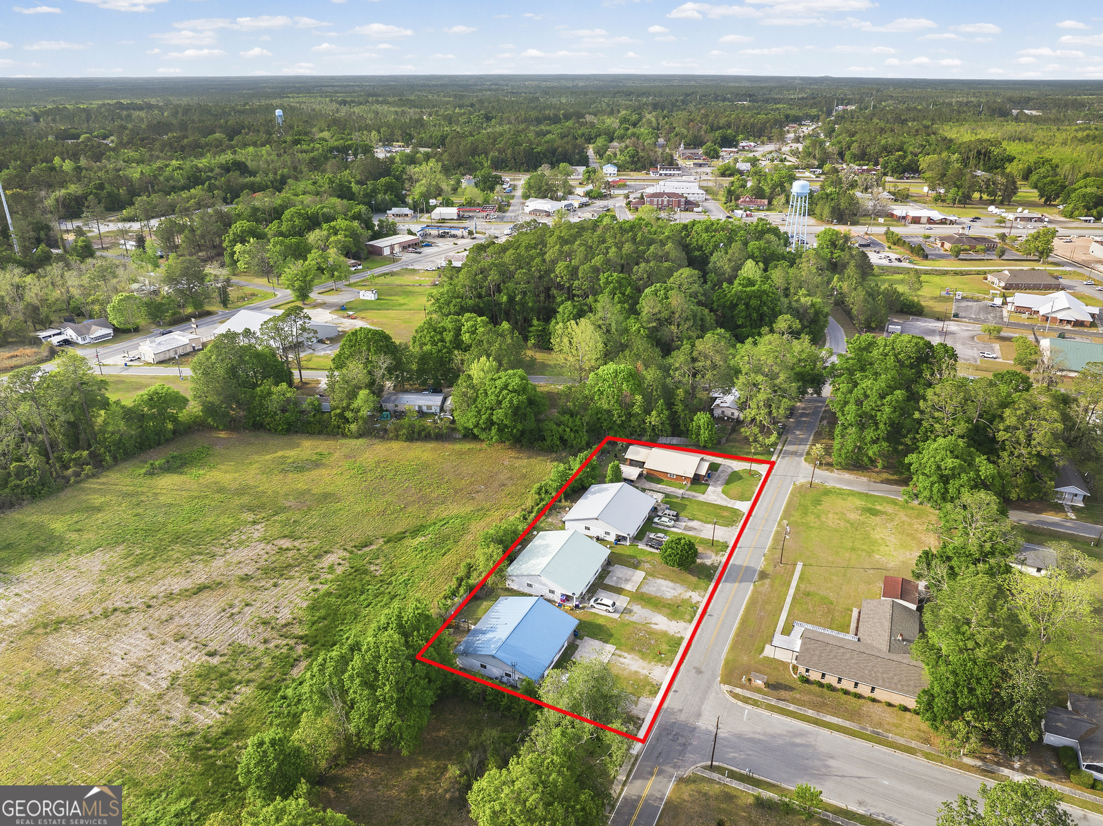 304 Cannon Street Nahunta, GA 31553 - Photo 5 of 51 an aerial view of residential houses with outdoor space and river