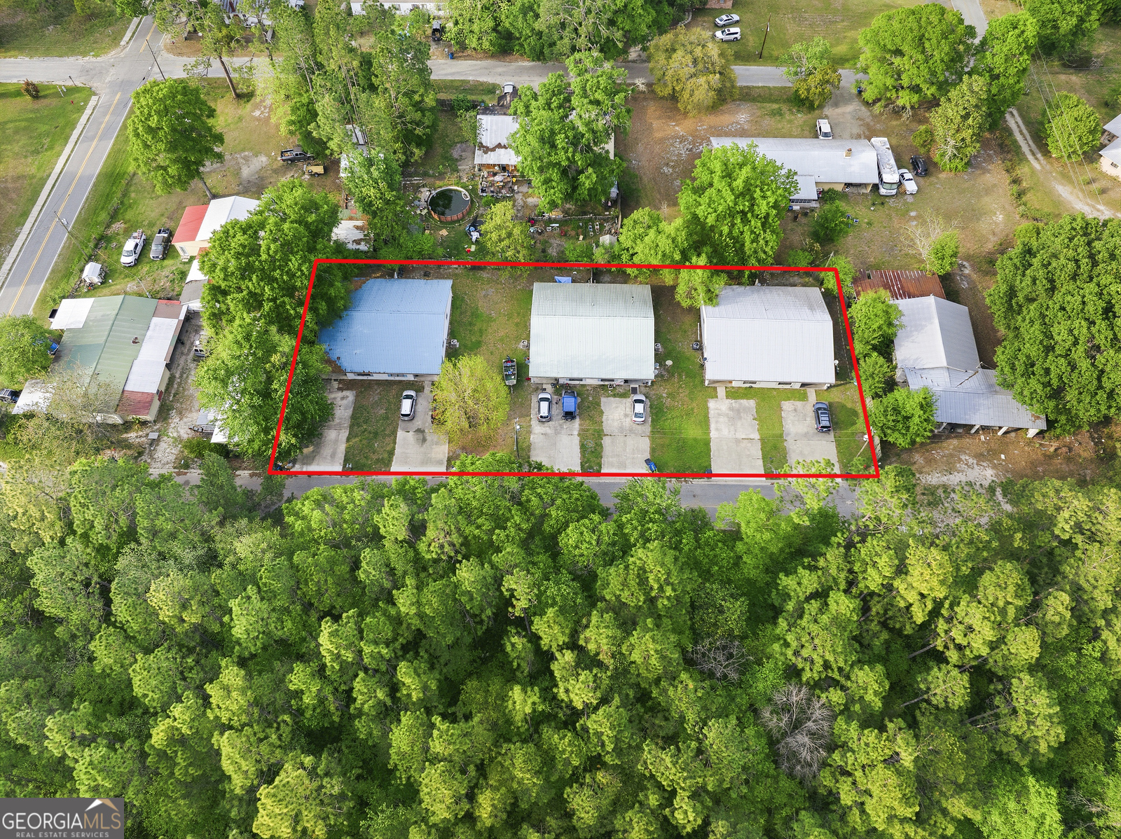 304 Cannon Street Nahunta, GA 31553 - Photo 51 of 51 an aerial view of a house with a yard and lake view