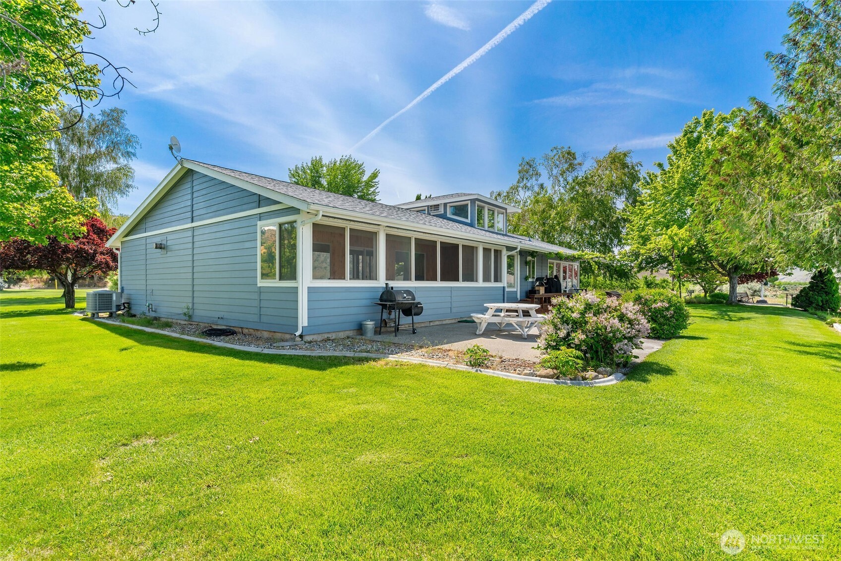 32 Midland Road Brewster, WA 98812 - Photo 4 of 40 a view of a house with a yard patio and swimming pool