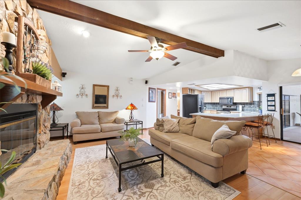 5227 Suwannee Road Weeki Wachee, FL 34607 - Photo 15 of 62 a living room with furniture and a ceiling fan