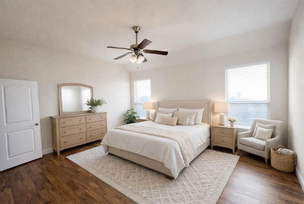 620 Calliopsis Street Little Elm, TX 75068 - Photo 8 of 30 Bright, spacious bedroom with rich hardwood floors and abundant natural light — a comfortable and inviting retreat with room for full furnishings.