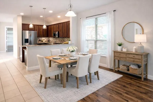 a utility room with sink dryer and washer